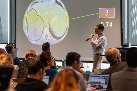 CAC-2023-22 Speaker at the 10th Annual Charge Against Cancer event presents on the effects of AI on cancer research.