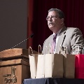 Man speaking at podium
