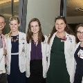 Five students pose for a photo