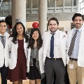 Five students pose for a photo