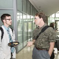 Two people are speaking to each other
