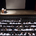 speaker in spotlight at ceremony