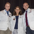 three people smiling